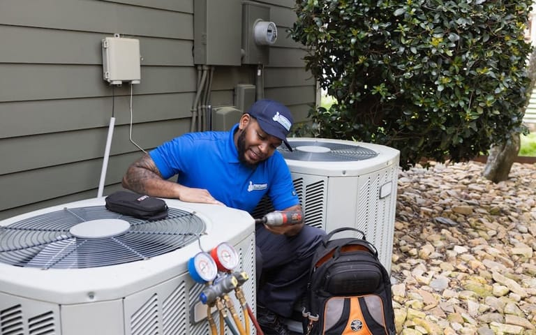 Central air conditioning installation outdoor unit technician