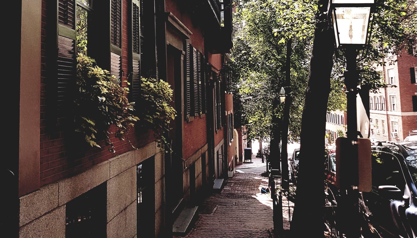 Beacon Hill brick rowhouses on a quiet Boston street
